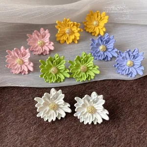 Elegant and colorful multi-layer flower petal stud earrings featuring textured golden centers