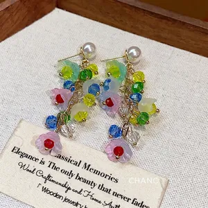 Elegant resin flower tassel earrings featuring colorful crystal beads and faux pearls