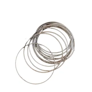 Elegant minimalist silver multi-layer metal bangles set with textured and smooth finishes