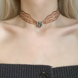 Vintage brown lace flower edge choker necklace featuring a sparkling rhinestone star pendant