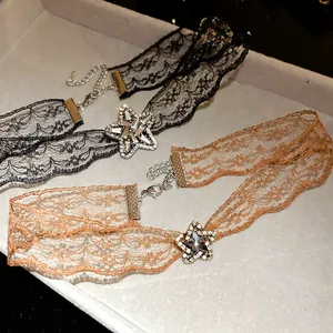 Detailed close-up of vintage lace star choker necklaces with shimmering rhinestones