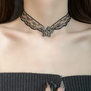 Close-up detail of a vintage black lace choker featuring a sparkling rhinestone star pendant