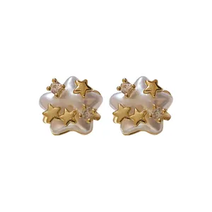 Elegant pearlescent star stud earrings featuring zircon and gold star accents for women