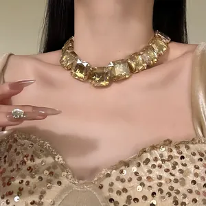 Close-up of a glamorous palace-style choker with large champagne square crystals