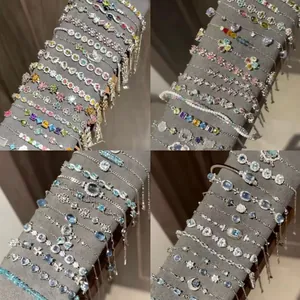Collezione di braccialetti in zircone con tagli quadrati e a goccia colorati.