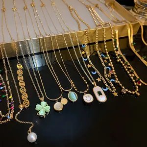 Elegant assortment of titanium steel gold necklaces with emerald and geometric pendants