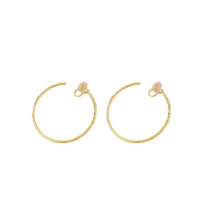 Minimalist gold hoop clip-on earrings with comfortable silicone pads for non-pierced ears.