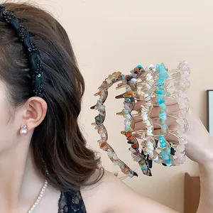 Close-up of elegant acrylic headbands with irregular crushed stones in multiple colors