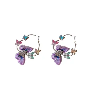 Fashionable butterfly hoop earrings with purple embroidery and sparkling crystals