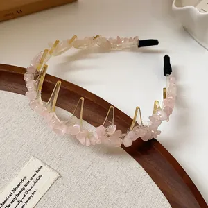 Macro detail of irregular pink stone acrylic headband with retro wavy teeth design