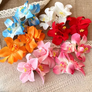 Collection of colorful vacation-style fabric flower hair clips on lace background