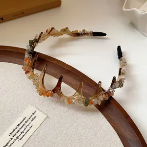 Macro view of a vintage headband with irregular crushed stones and acrylic teeth
