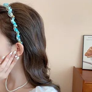 Close-up of blue irregular stone headband detail showing the texture and design