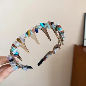 Detailed macro view of colorful irregular natural stone chips on a brown acrylic headband