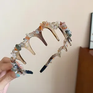 Detailed view of a vintage style hair hoop decorated with colorful irregular stones