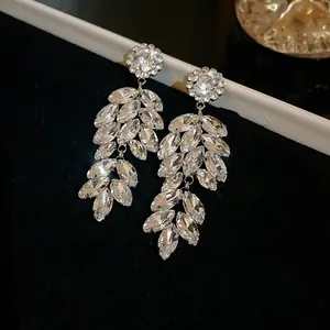 Detailed view of marquise-cut crystal wheat ear earrings in silver setting