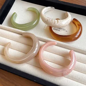 High-quality acrylic marbled open bangle bracelets in assorted colors for women