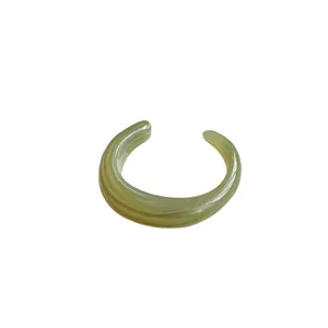 Minimalist light green marbled acrylic open bangle bracelet with a smooth finish