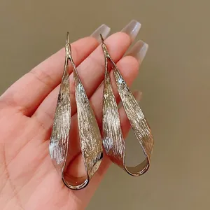 European style exaggerated metallic twisted teardrop earrings with textured finish