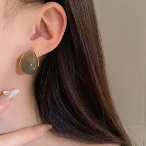 Vintage water drop geometric earrings with dark grey resin and elegant gold trim