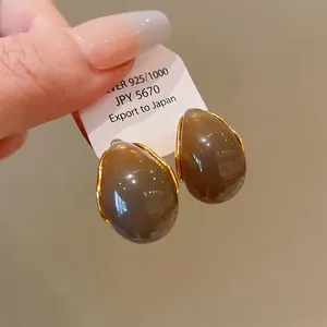 Detailed view of vintage Maillard brown waterdrop earrings featuring S925 silver needles