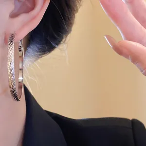 Silver textured hoop earrings for women with elegant diagonal pattern fashion jewelry