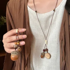Ethnic style adjustable wax cord necklace featuring wood beads and a natural acorn pendant