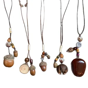 Ethnic wax cord necklace set with wood beads and natural acorn pendants for women.