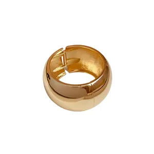 Minimalist gold-toned polished wide cuff bangle with a hinged spring opening for women