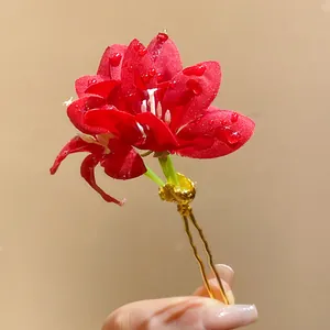 Elegant red fabric flower hair pin with golden fork for sweet and fresh vacation style