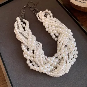 Elegant multi-layer pearl choker necklace with a vintage rhinestone knot design