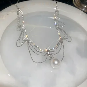 Elegant French-style multi-layer rhinestone necklace with large pearl pendant detail