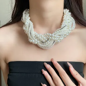 Detailed view of an elegant multi-layer pearl necklace with sparkling rhinestone accents