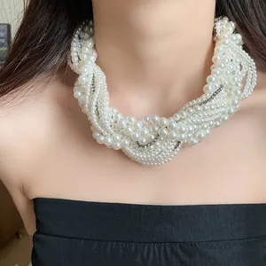 Close-up of vintage multi-strand knotted pearl necklace with elegant rhinestone details
