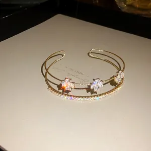 Elegant Korean style gold bracelet featuring sparkling zircon flowers and crystals detail
