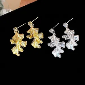 Elegant silver needle pleated leaf dangle earrings in gold and silver metallic finishes