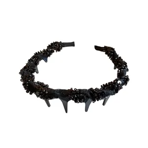 Elegant black mesh wrapped headband with glass beads and a stylish high skull top design