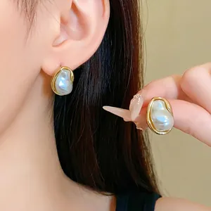 French retro stud earrings with irregular faux pearls and gold crumpled rim