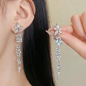 Elegant silver needle long crystal drop earrings with floral design for formal dress outfits