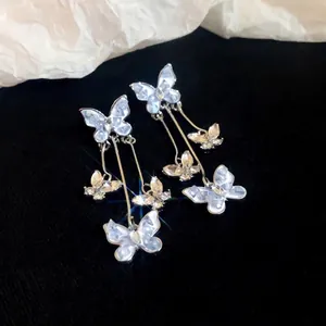 Elegant silver needle butterfly tassel earrings with sparkling crystals for formal evening wear.