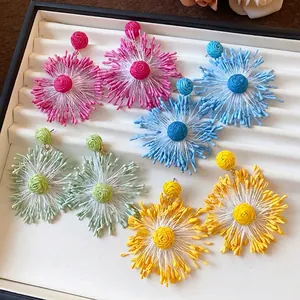 Handmade woven flower firework earrings in vibrant colors for a stylish vacation look
