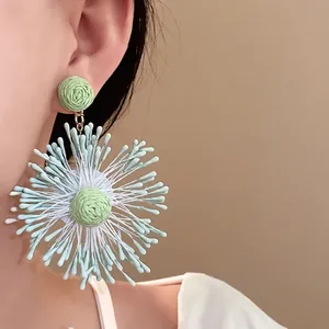 Elegant handmade woven flower firework drop earrings for women in holiday style.