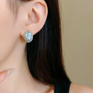 French vintage faux pearl stud earrings featuring irregular silver pleated edges