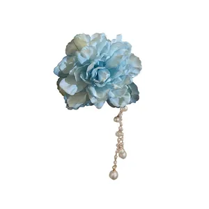 Elegant light blue fabric flower hair clip with long faux pearl tassel for stylish updos