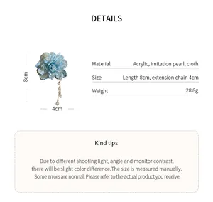 Detailed view of floral hair clip with pearl tassels, material and size specs