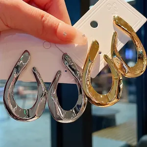 Chunky metallic twisted hoop earrings in gold and silver finishes for women fashion