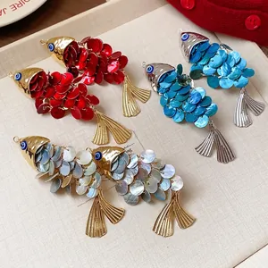 Vintage ethnic style shell fish-shaped duckbill hair clips in vibrant red, blue and white