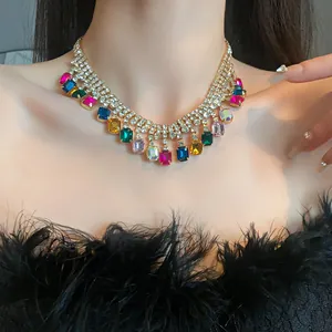 Close-up of a chunky geometric choker necklace featuring vibrant multicolored rhinestones