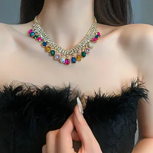 Close-up of a glamorous multi-colored geometric rhinestone choker necklace on a model
