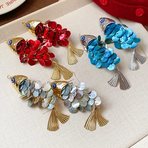 Detailed macro view showcasing three colors of vintage shell fish-shaped hair clips